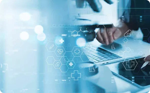 Person using a laptop with digital icons overlayed