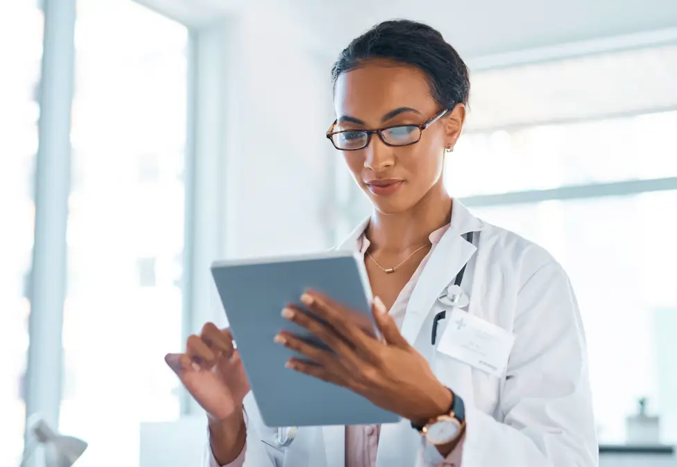 Physician reviewing tablet