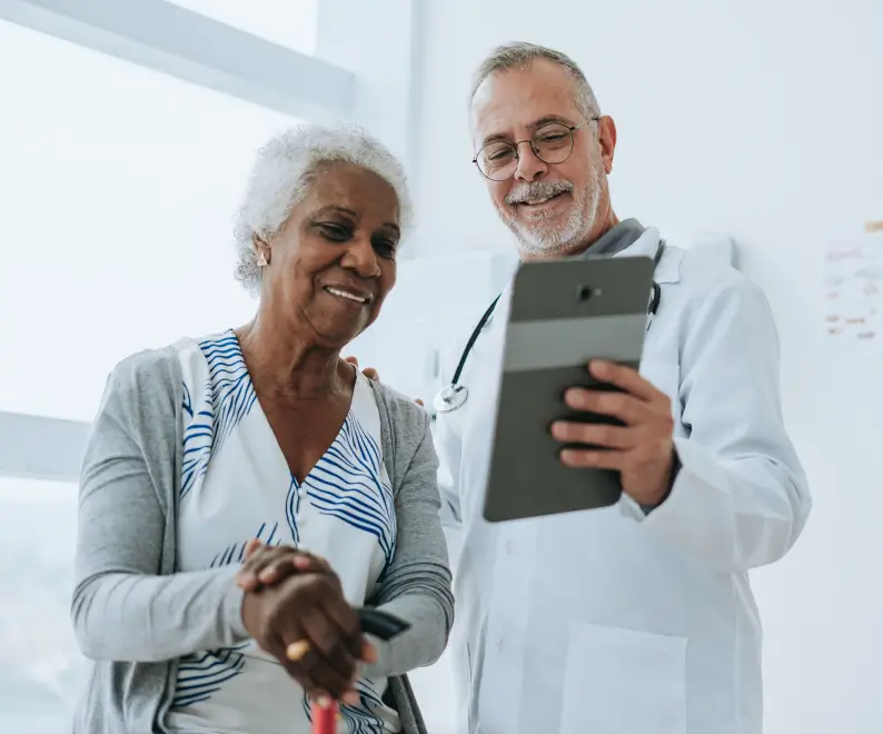 Medical professional and patient review a tablet together