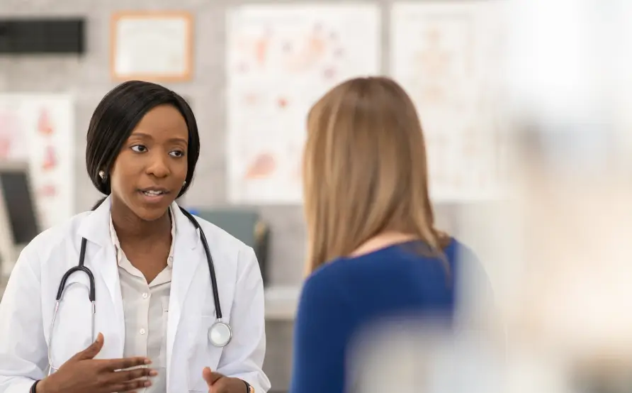 Physician speaking with a patient