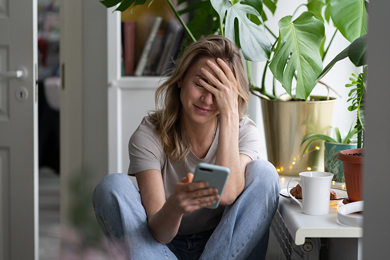 woman stress laughing on hold